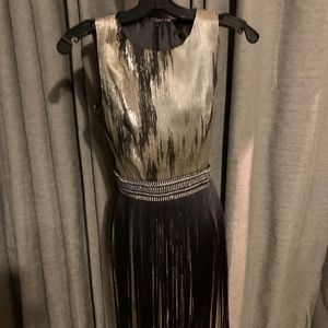 Jumpsuit with detachable fringe skirt